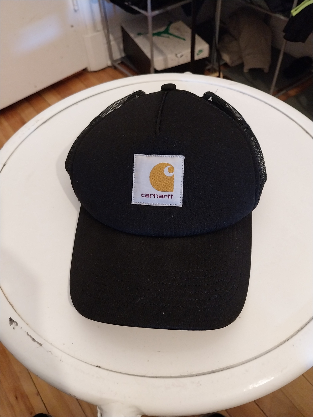 Carhartt Black Trucker Cap with Gold Logo Patch